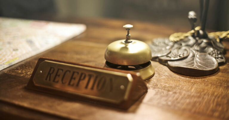 Hotel front office desk with a bell