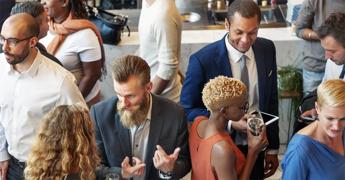A room full of people enjoying at an event.