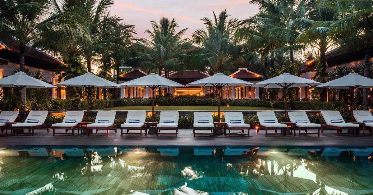 A tropical poolside setting at a small independent hotel.